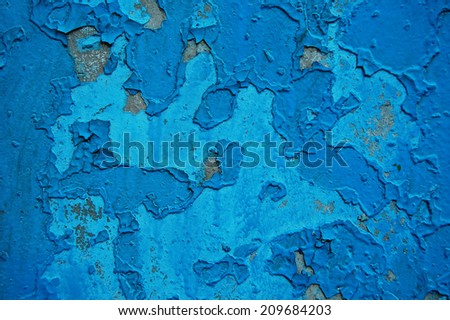 Old cracked paint pattern on rusty background. Peeling paint. Pattern of blue grunge material. Damaged paint. Scratched old plate