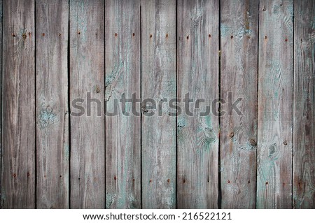Wooden Palisade background. Close up of grey and green wooden fence panels. Old wooden fence. wood texture background. wood fence background