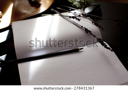 Open notebook with a sprig of lavender