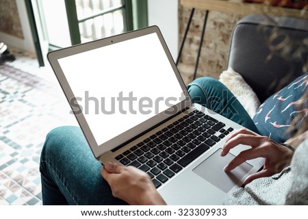Female person sitting front open laptop computer with blank empty screen