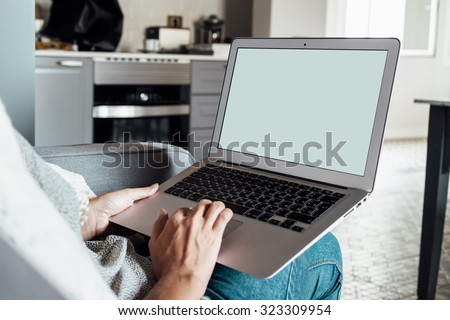 Female person sitting front open laptop computer with blank empty screen for your information or content