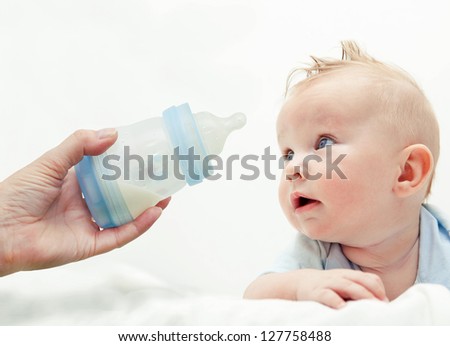 Boy with bottle of milk