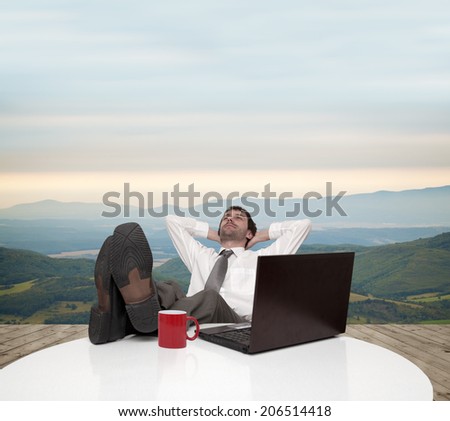 Young businessman resting after work in the countryside