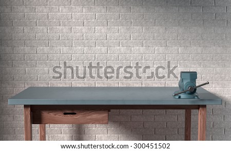 work table of a carpenter on white brick wall background