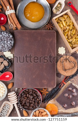 Sweet holiday recipes. Cover of the book to write prescriptions surrounded ingredients for a sweet holiday baking