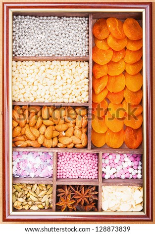 Set decorating baking. Wooden box with spices and decorations for pastry.
