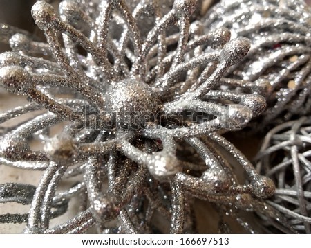 Sparkling silver Christmas decoration that looks like star forming the interesting background/Silver Christmas star