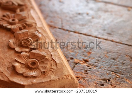 Carpenter wood carving on old weathered wooden workbench