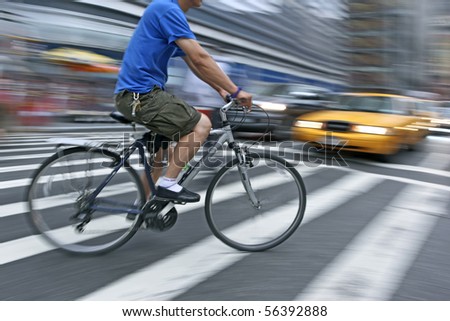 bike rider. ike rider crossing street