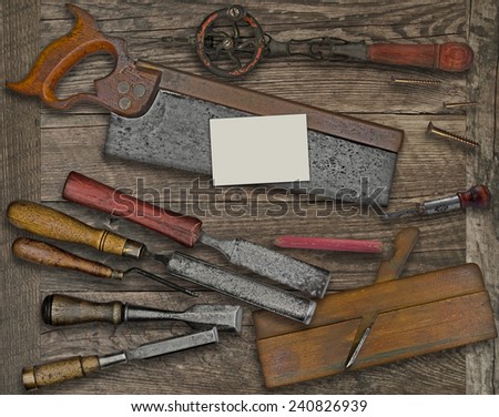 vintage woodworking  tools over wooden bench, blank business card for your text