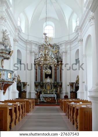 interior of an empty church with rows of benches