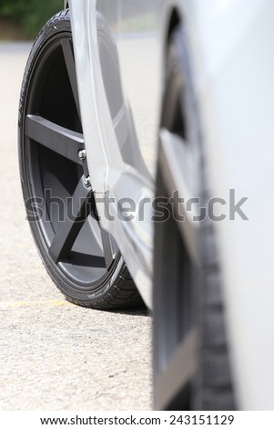 Car wheel on a car  (Focus on the left wheel)