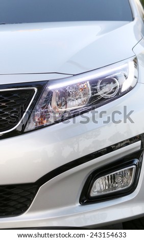 Detail of a front light in a luxury car (focus in the lamps)