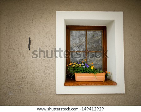 Vintage window box with flower arrangement