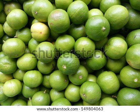 Fresh green Lemons background