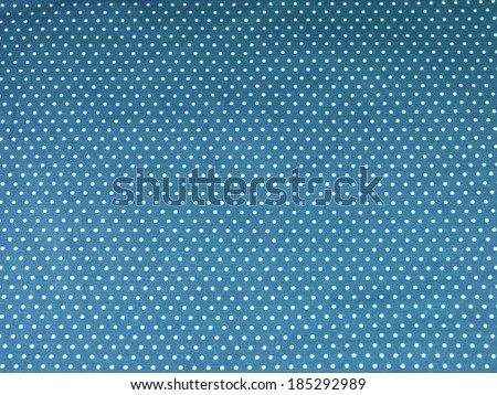 Seamless blue polka dot fabric background