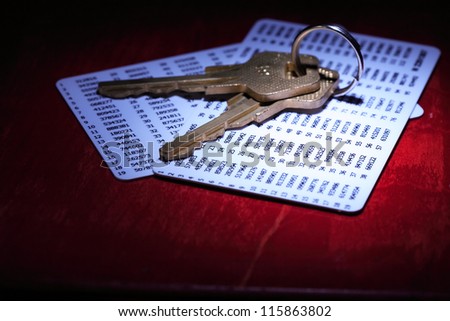 Security concept. Two keys lying on plastic cards with digits