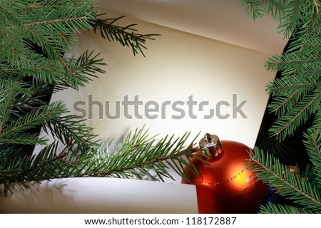 Christmas decoration. Blank scroll for text between fir twigs on dark background