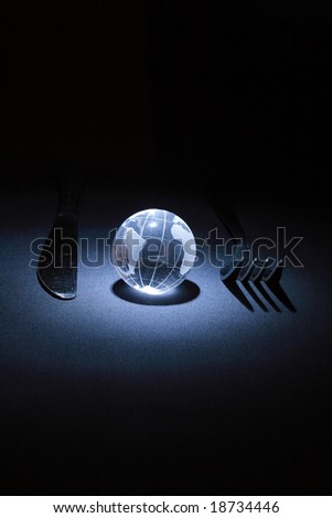 Glassy earth with fork and knife