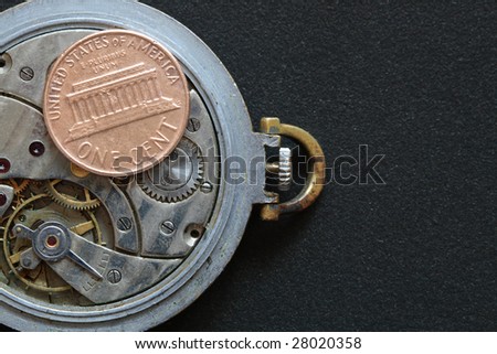 USA one cent coin lying on watch mechanism