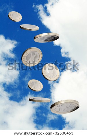 One euro coin flying on blue sky background. Object with clipping path