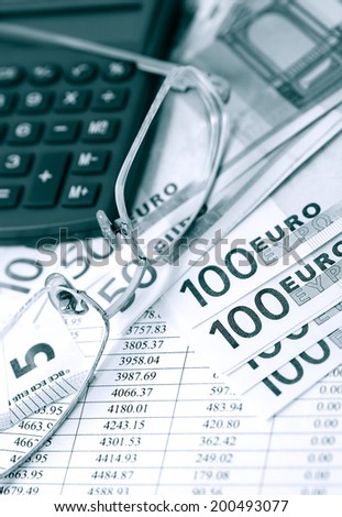 European Union Currency near calculator on paper background with digits table