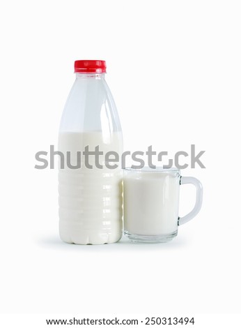 Plastic bottle near cup of milk on white background. Clipping path is included