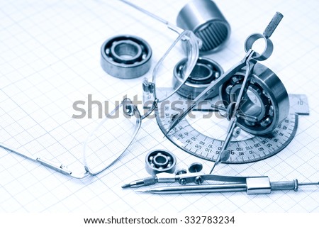 Engineering concept. Drawing instrument and rulers near spectacles on graph paper background
