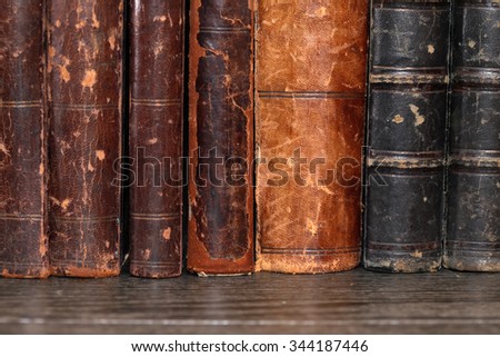 Ancient literature. Closeup of old books set in a row