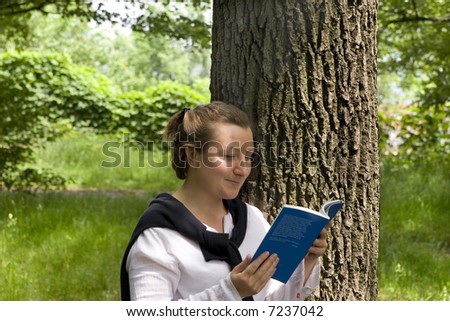 Young woman studying in the park