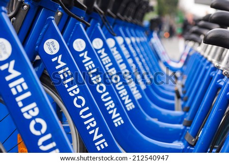 MELBOURNE, AUSTRALIA - AUGUST 16, 2014: Bicycles for hire as part of the Melbourne bike share program. Visitors can hire bikes to explore the city.