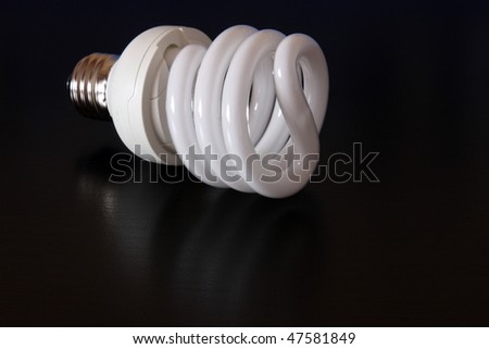 Compact fluorescent lightbulb isolated on black background