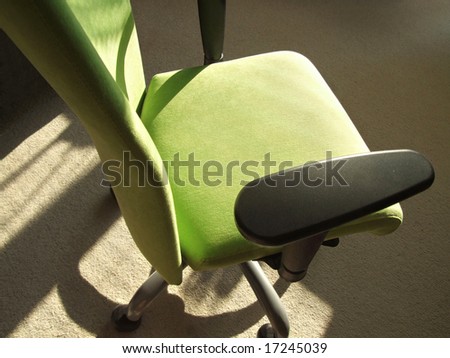 Modern computer chair on wheels.