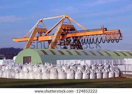 crane with warehouse and bulk bags