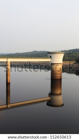 Water turbines at the Gileppe lake in Belgium. Reflected in water, nobody