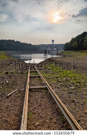 Rails going to the water at the Gileppe late in Belgium. Those rails are used to move a boat for maintenance.. nobody