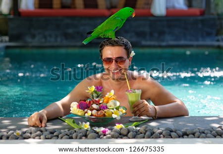 Tropical Paradise, Handsome man enjoying his dream vacations in luxury villa on Bali, Indonesia