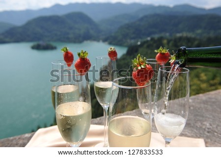 Catering, The waiter pours champagne into crystal glasses