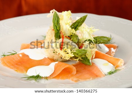 Close up of smoked salmon salad with green asparagus