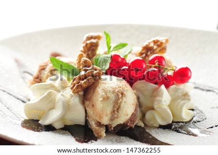 Nut ice cream with cranberries and cream