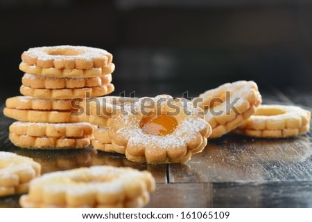 Stack of homemade sweet biscuit cookies with jam