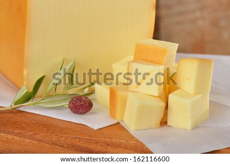 Cheddar Cheese on a wooden board