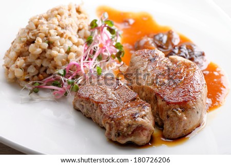 Grilled pork tenderloin with prunes and buckwheat