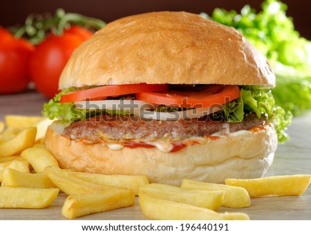 Big juicy gourmet burger with chips