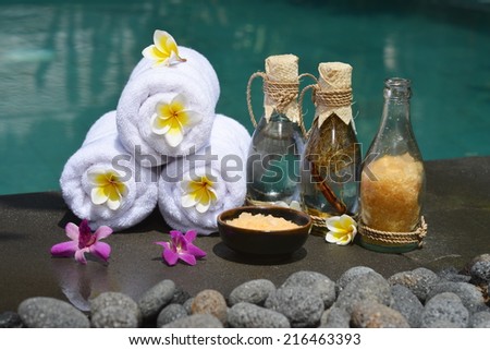 At the Spa, concept in a luxury Villa on Bali Island with, Massage oil, bath-salt, Volcanic stones, body scrub, Towels,Cinnamon sticks, Orchids and flowers.