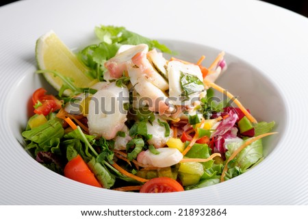 octopus salad with lemon slice lettuce and potatoes