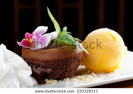 Fine dining, Chocolate souffle with mango ice cream and coconut foam / Fusion food