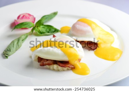 Eggs Benedict- toasted English muffins, ham, poached eggs, and delicious buttery hollandaise sauce