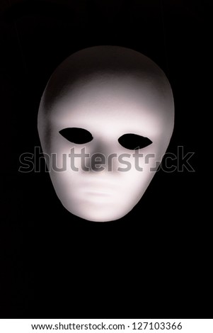 White Full Face Mask on Isolated Black Background