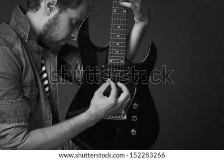 guy hugging a guitar